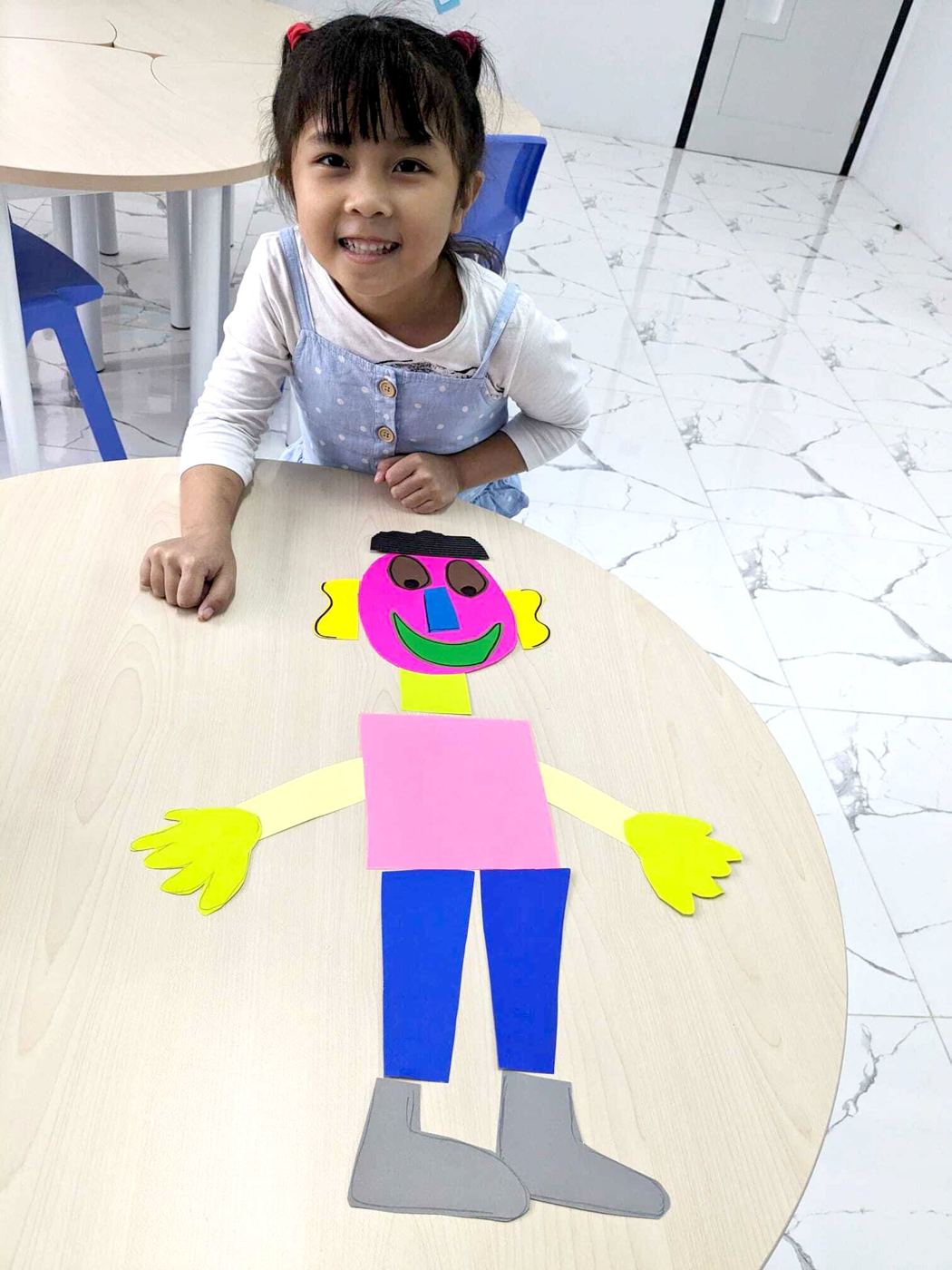 A pupil with her class project
